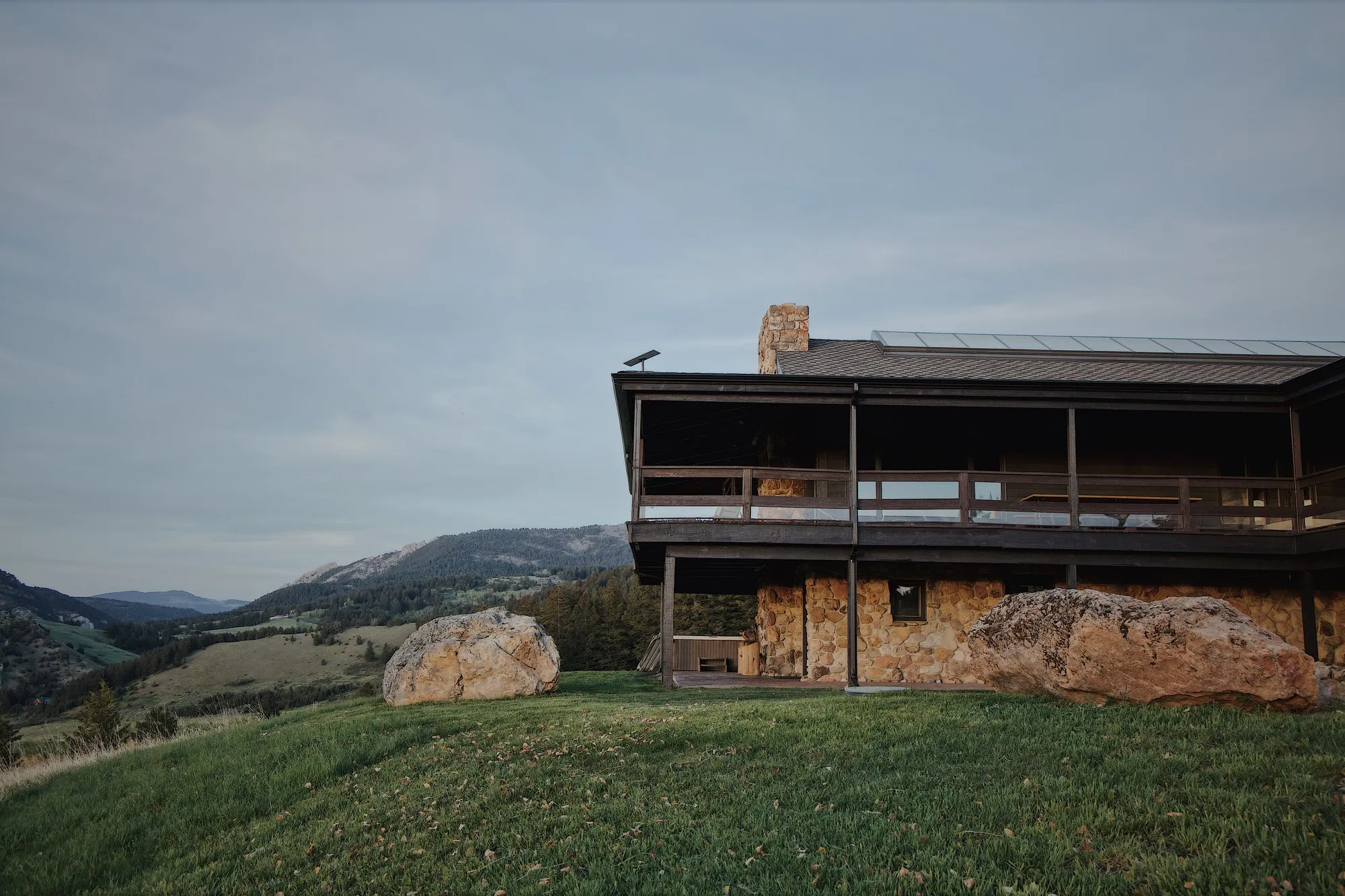 The lodge on its hillside, evening light.