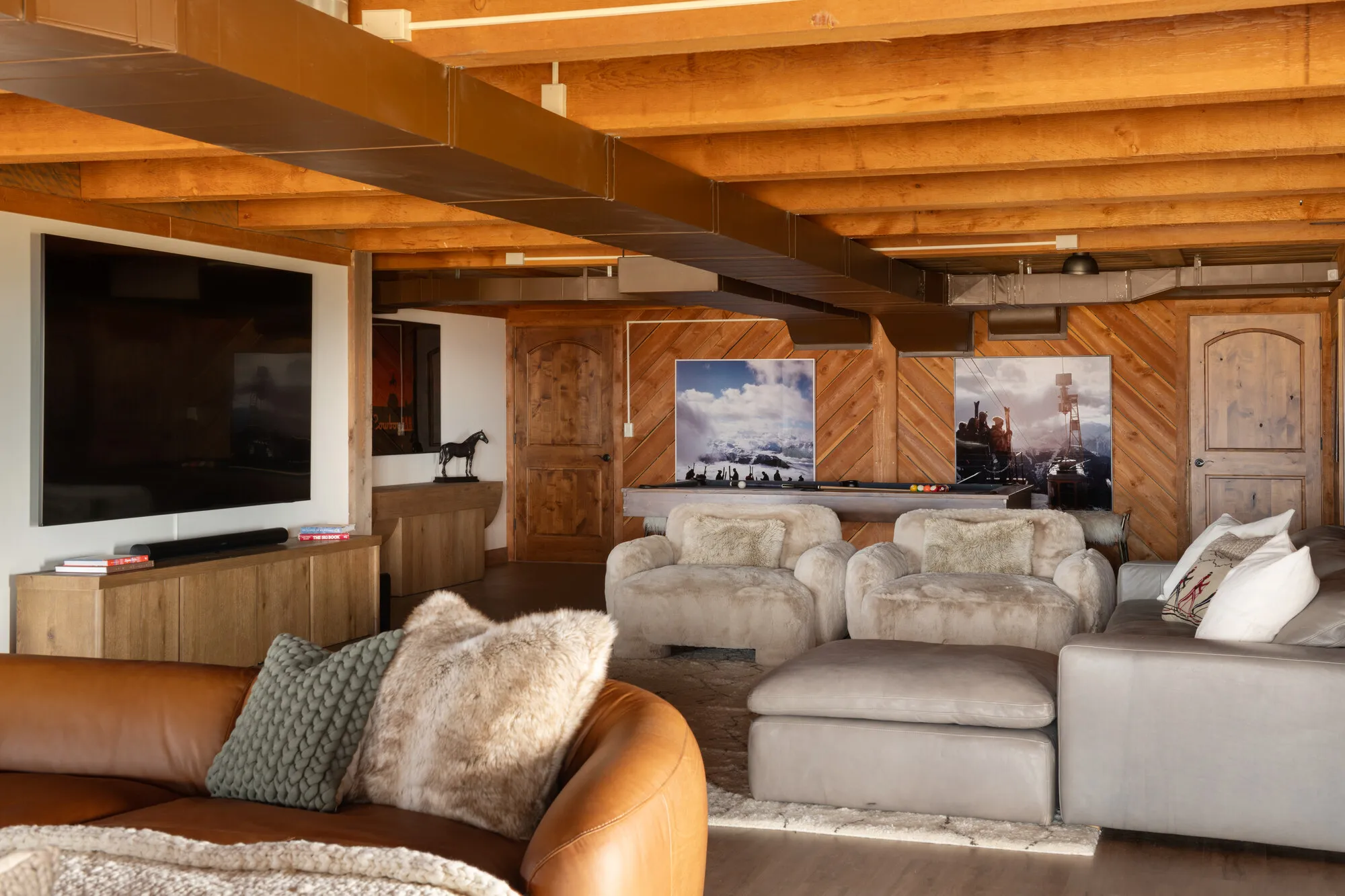 The 98-inch screen and Sonos surround, downstairs.