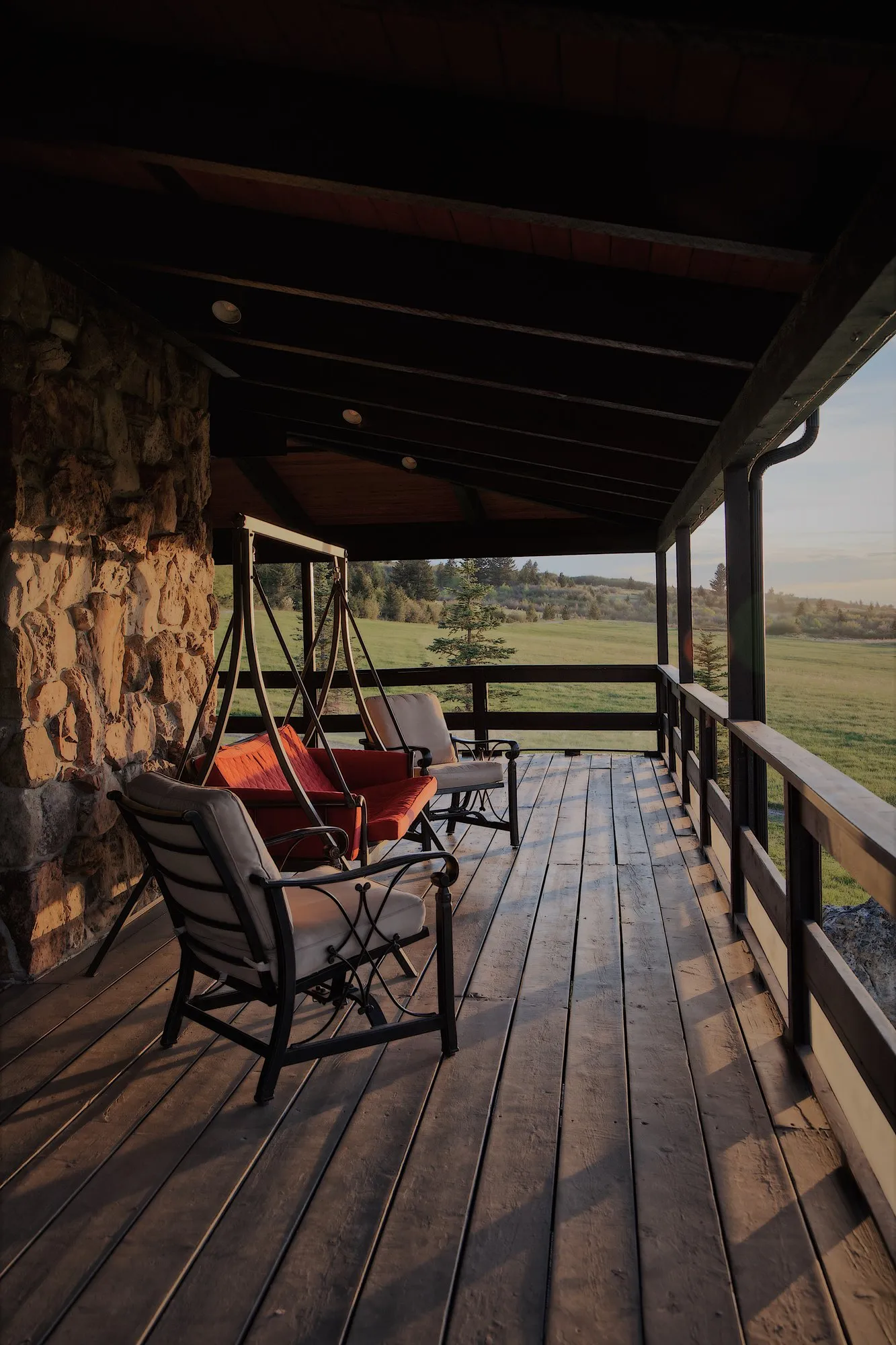 The wrap-around porch, late in the day.